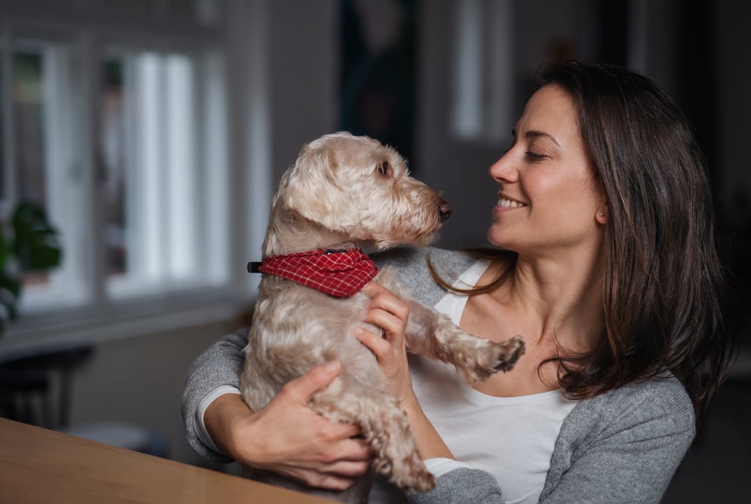 Woman with Dog Indoors